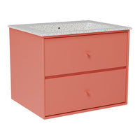 Coral pink cabinet with two drawers and a speckled white top, perfect for modern decor.