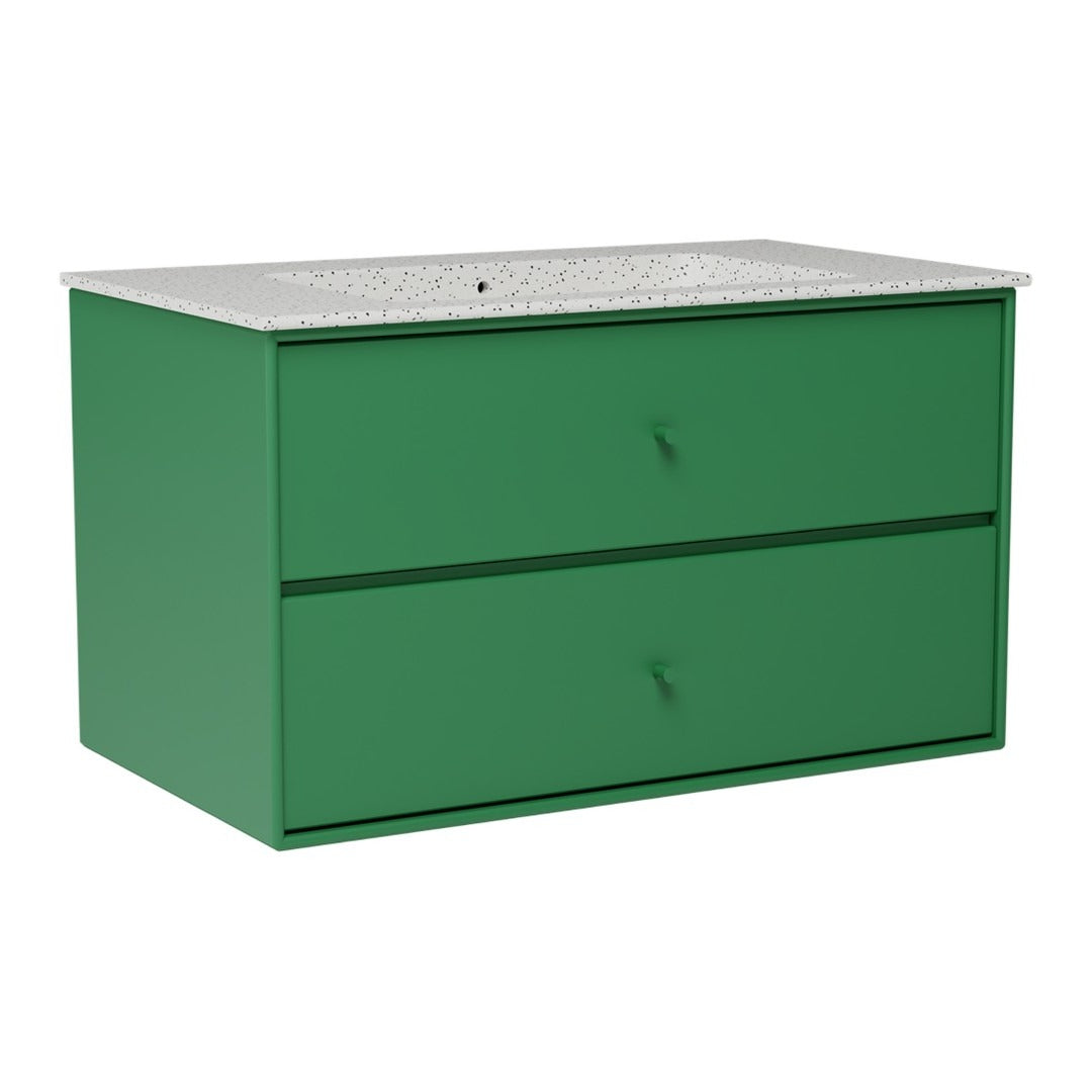 Green wooden dresser with two drawers and a speckled gray countertop. Modern and minimalist design.
