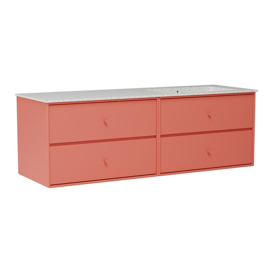 Coral-colored dresser with a smooth white top and minimalist design featuring four drawers.