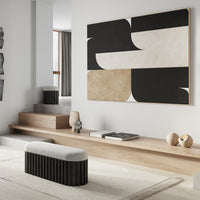 Abstract wall art featuring black, cream, and beige geometric patterns on a modern backdrop.