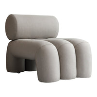 Modern gray accent chair with smooth, rounded shapes and a textured fabric finish, perfect for contemporary decor.