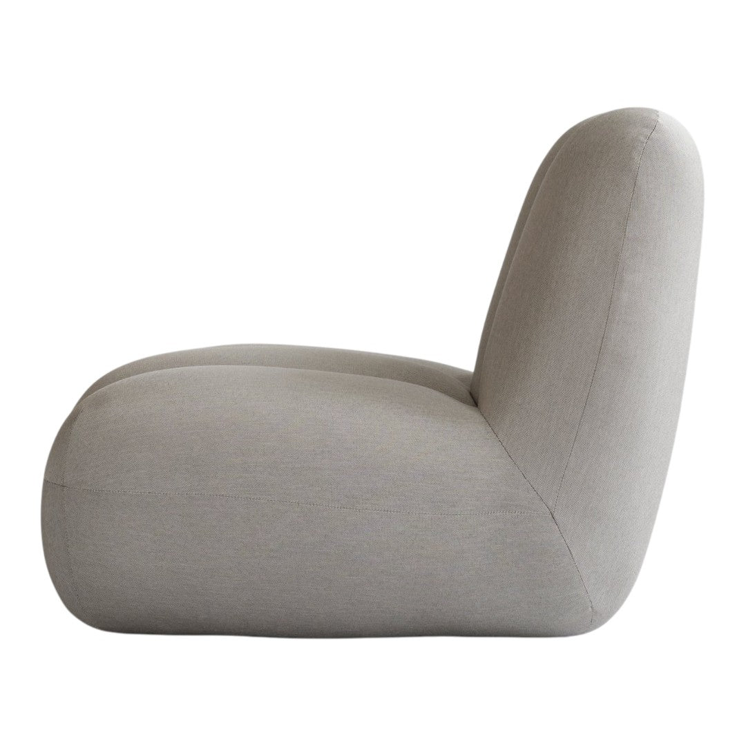 Gray fabric chair with a smooth, minimalist design, featuring soft curves and a seamless finish.