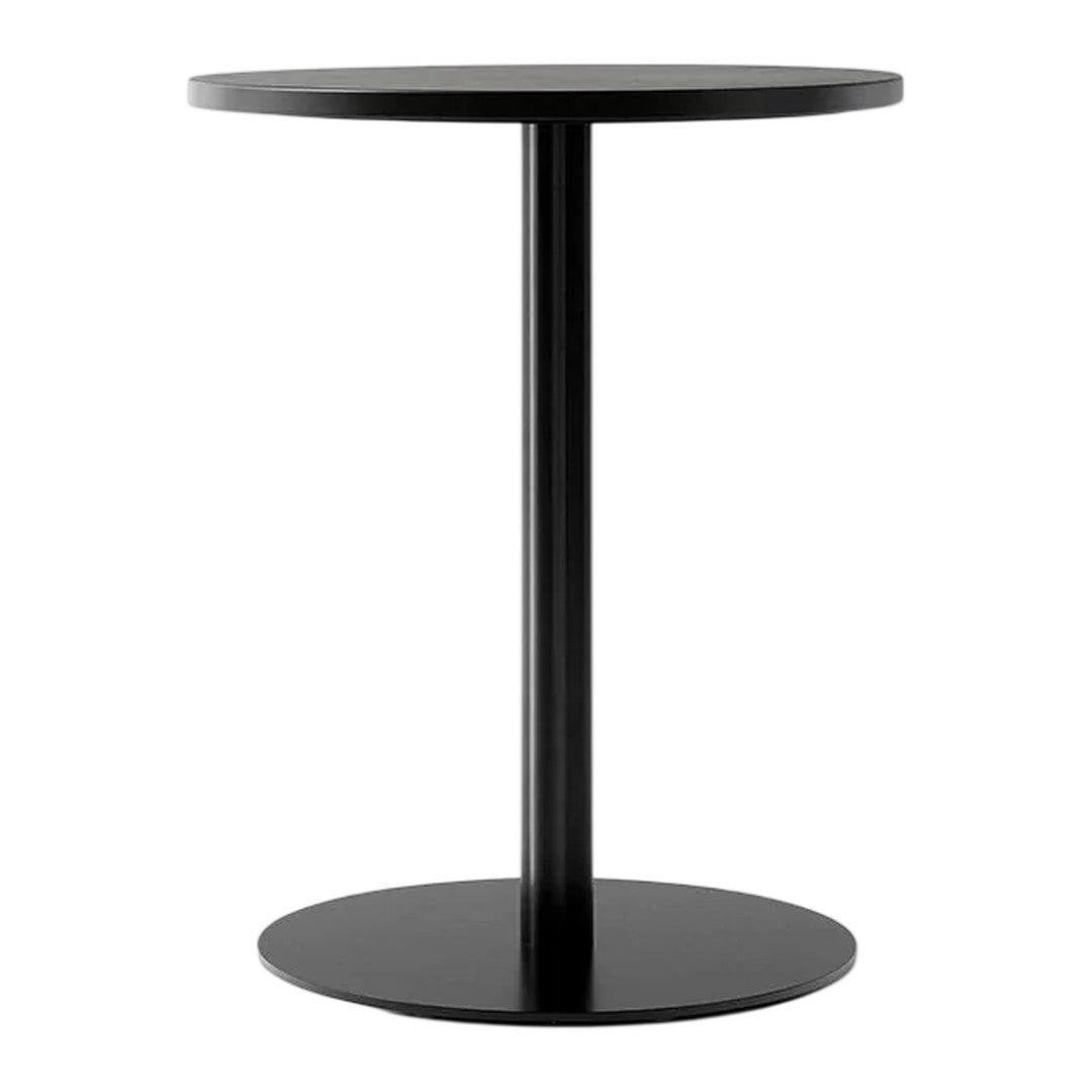Black circular side table with a sleek, minimalistic design and smooth matte finish. Ideal for modern decor.