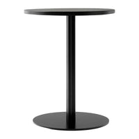 Black circular side table with a sleek, minimalistic design and smooth matte finish. Ideal for modern decor.