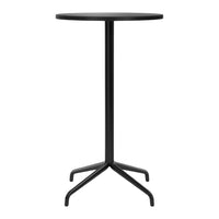 Black minimalist round bar table with a sleek, smooth finish and sturdy four-legged base. Perfect for modern spaces.