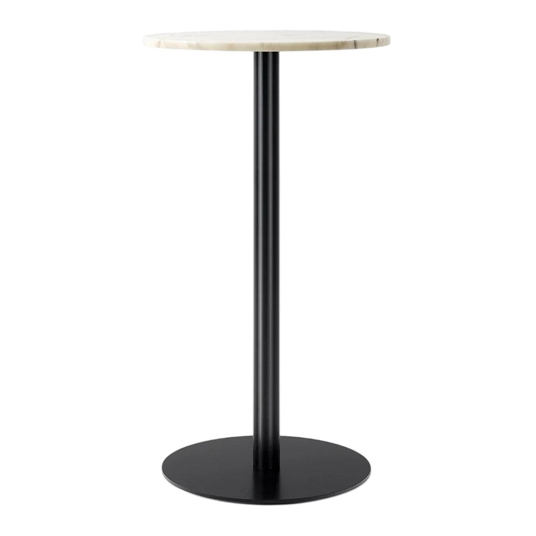 Round marble top in cream with a sleek black metal base, perfect for modern decor. 