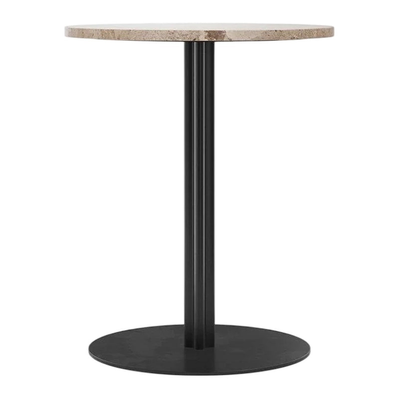 Round table with a textured beige top and sleek black base, perfect for modern decor.