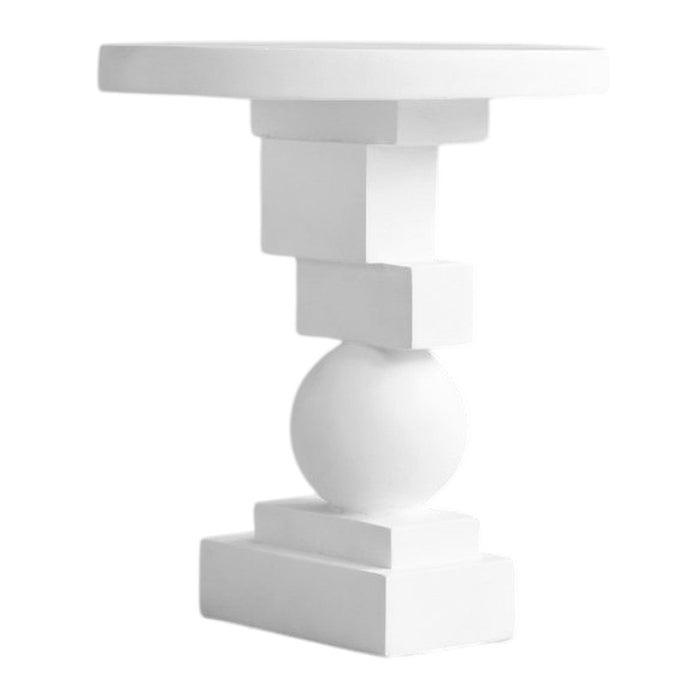 White geometric side table with a round top, ball and block features in a minimalist design. Perfect for modern decor.