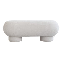 White boucle ottoman with textured pattern and rounded form, featuring soft, cozy fabric design.
