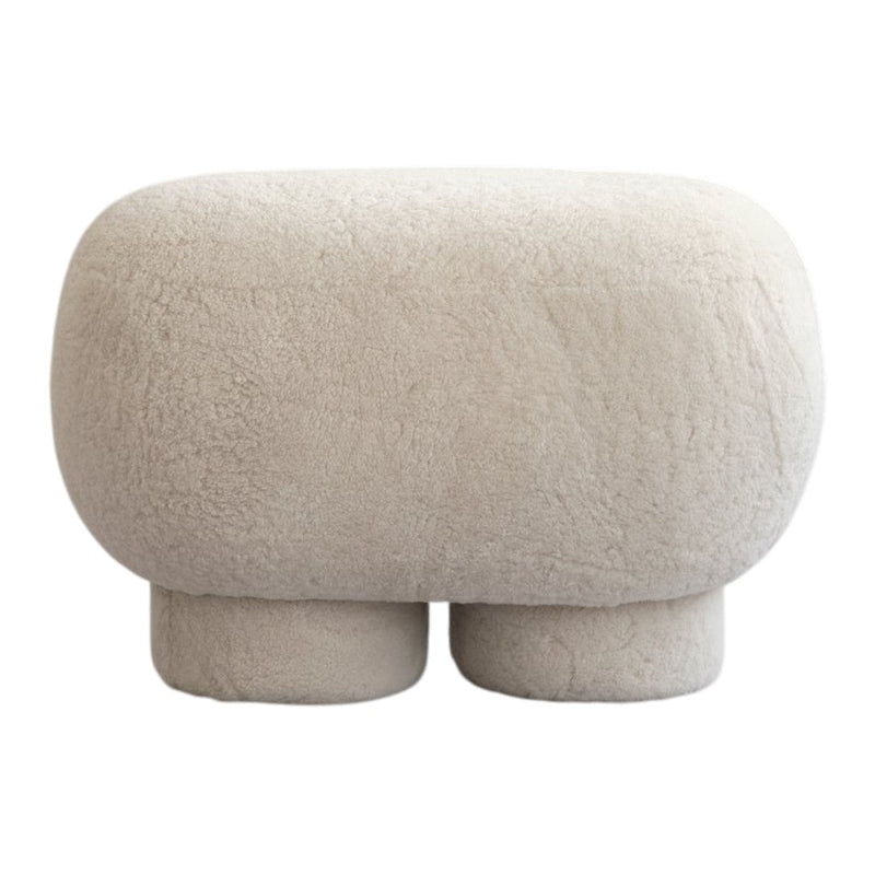 Beige textured pouf with a soft, fluffy finish, perfect for modern decor.