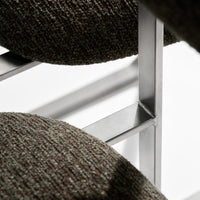 Textured gray fabric upholstery with subtle brown flecks on a modern metal chair frame.