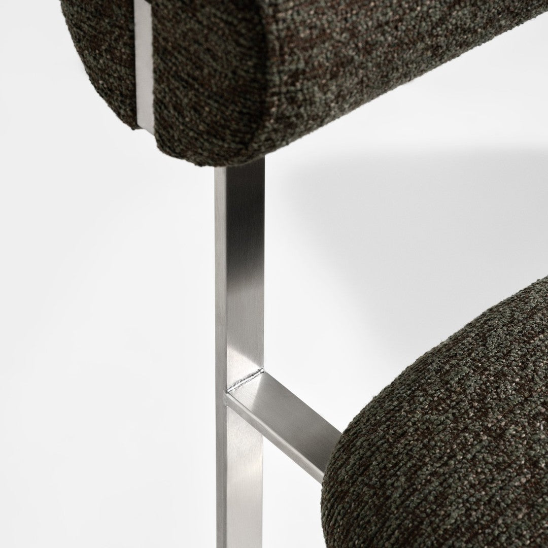 Textured brown fabric with subtle gray and green tones on a modern chair design.
