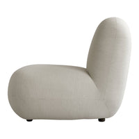 Beige textured sofa with a smooth, minimalistic design and rounded edges. Perfect for modern decor.