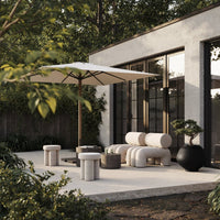 Minimalist outdoor seating in soft beige and gray tones, featuring sleek shapes and natural textures. Elegant design.