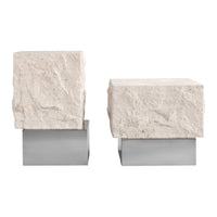 Natural beige stone blocks atop sleek silver bases, showcasing a modern, minimalist design.