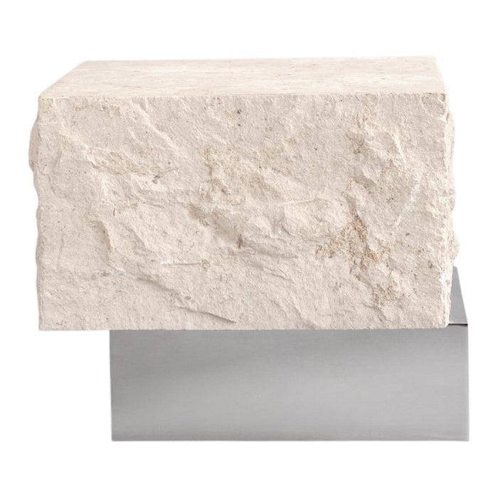 Textured off-white stone block with a sleek silver base, creating a modern, minimalist design.