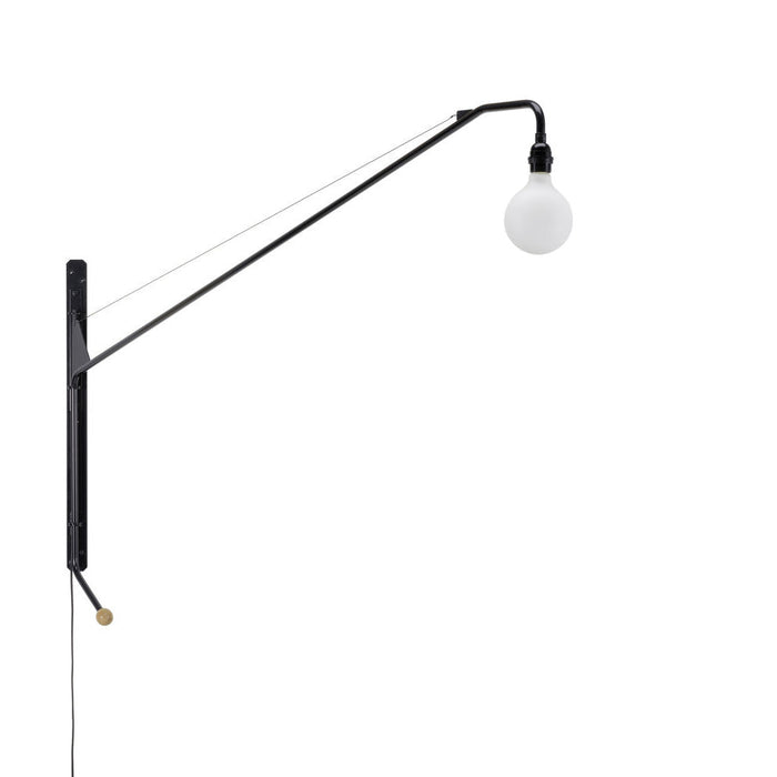 Black metal wall lamp with a white globe bulb and sleek, minimalist design. Simple lines and modern aesthetic.