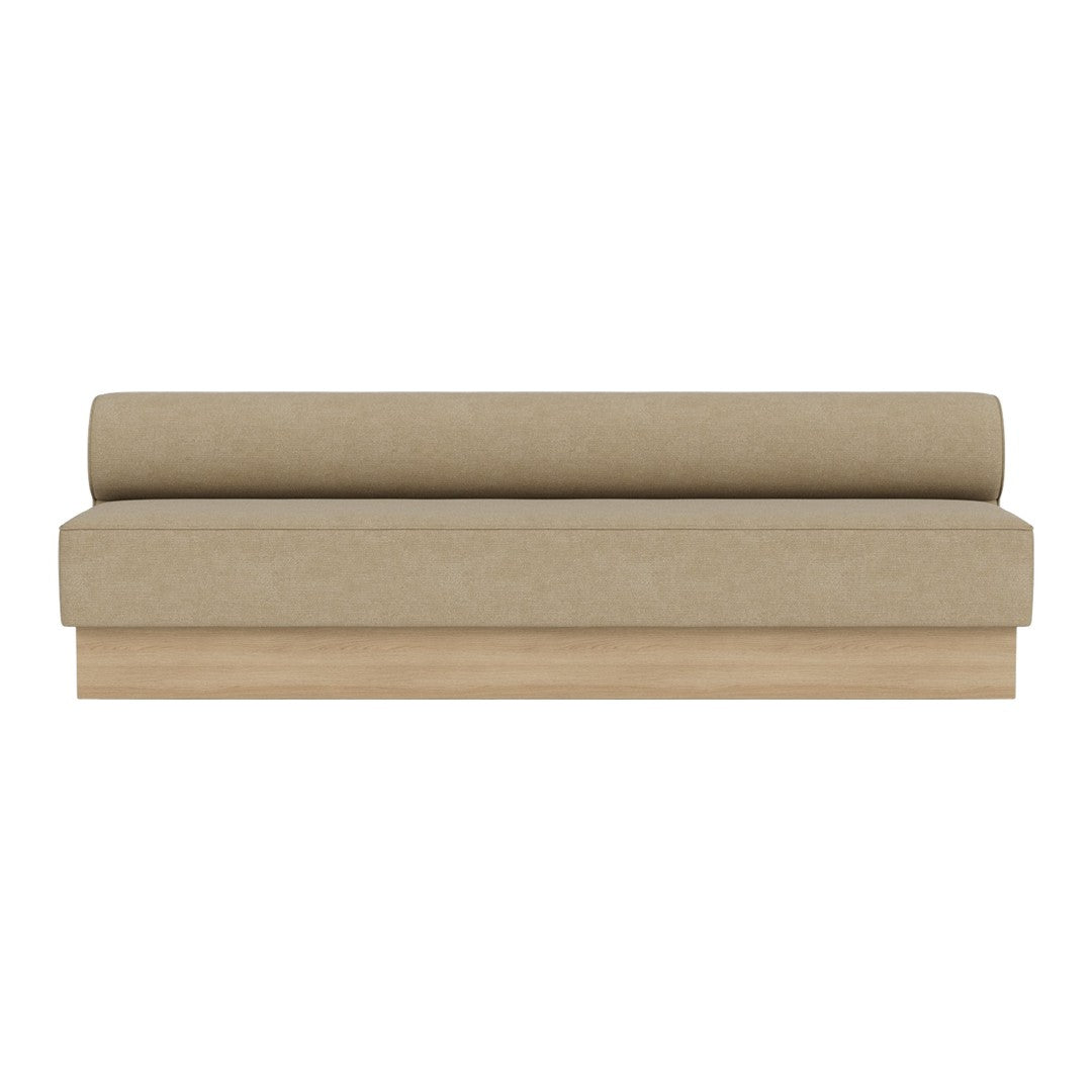 Beige sofa with a smooth texture and a simple, modern design featuring a rounded backrest and wooden base.