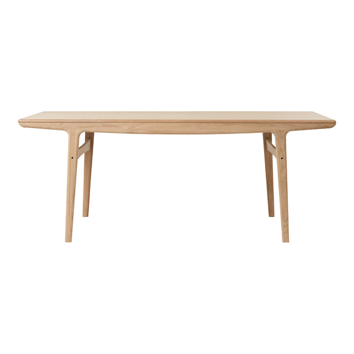 Light oak dining table with a smooth, natural wood finish and clean, minimalist design. Perfect for any dining space.