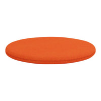 Bright orange round cushion with a smooth texture, perfect for adding a pop of color to any space.
