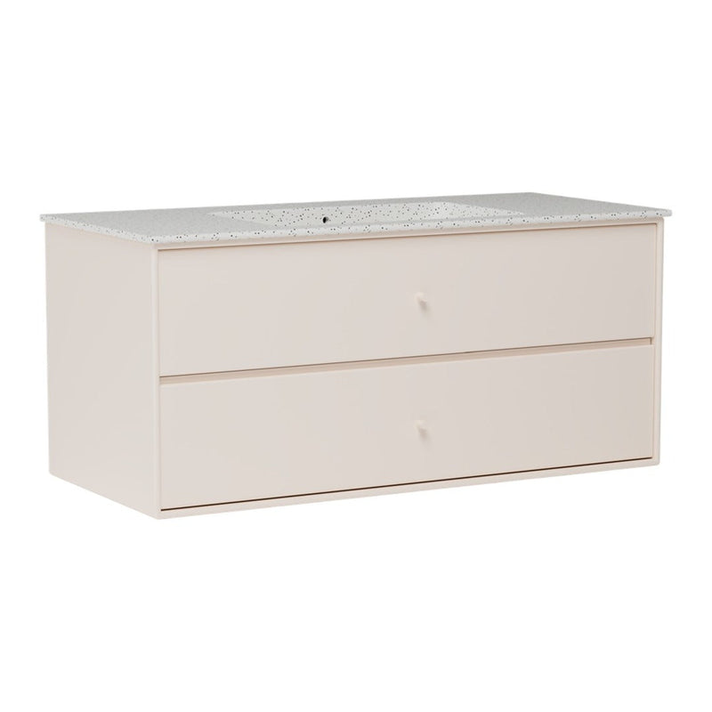 Light pink storage dresser with a patterned white top and two spacious drawers. Elegant and modern design.
