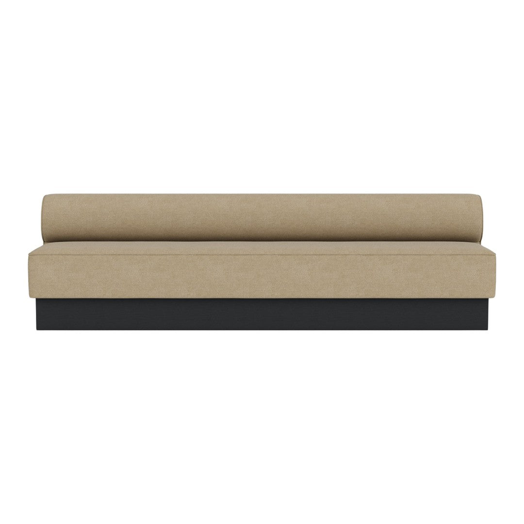 Beige upholstered sofa with a smooth texture and a contrasting black base. Minimalist design with a contemporary appeal.