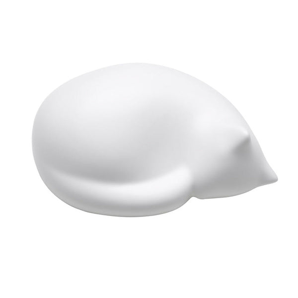 White sleeping cat figurine with smooth, rounded shape, perfect for minimalistic decor.