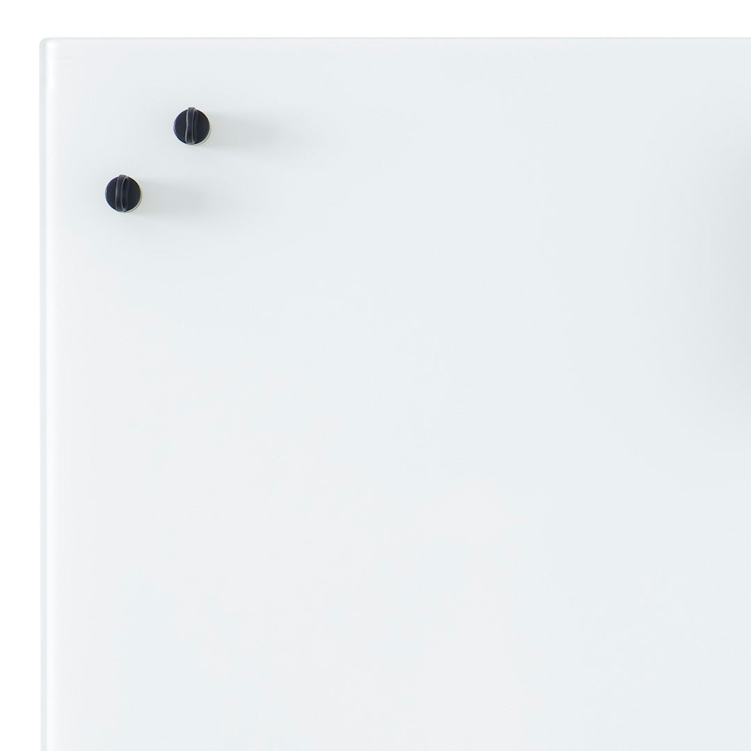 White surface with two black knobs, minimalist design, perfect for modern decor.