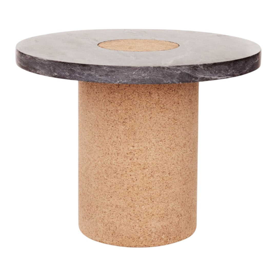 Round table with a dark gray top and textured cork base, showcasing a modern, minimalist design.