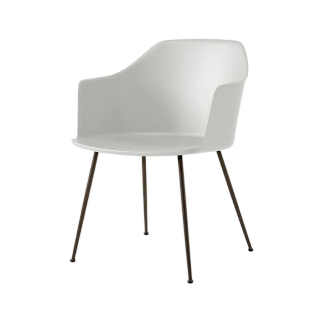 Modern white armchair with sleek lines and dark metal legs, perfect for contemporary decor.
