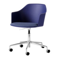 Blue ergonomic chair with a sleek, solid navy back and a textured denim seat, set on a chrome wheeled base.