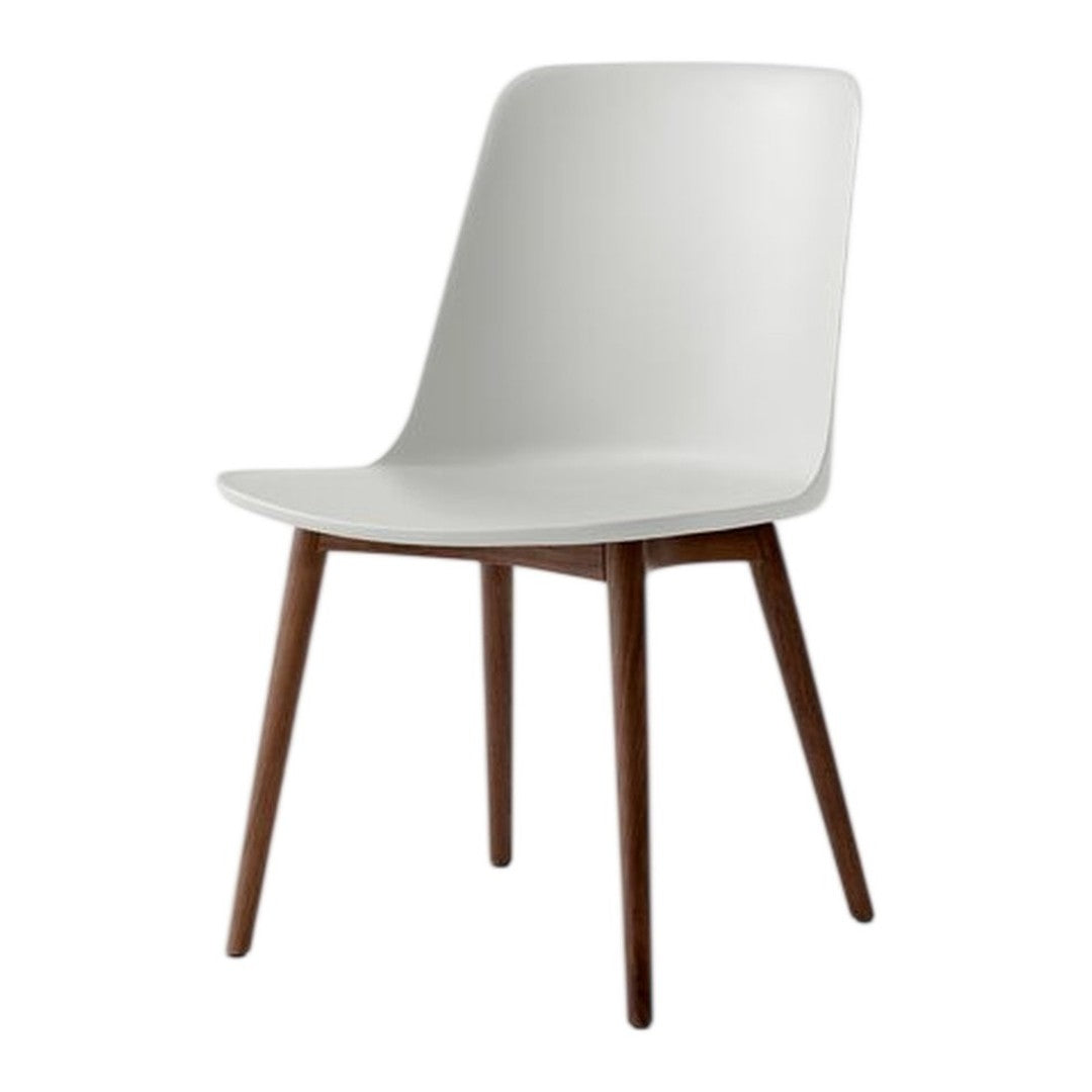 Stylish white chair with smooth finish and natural wood legs, perfect for modern and minimalist decor.