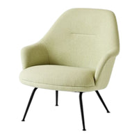 Light green upholstered chair with a smooth texture and sleek black metal legs. Perfect for modern decor.