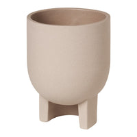 Simple beige planter pot with a textured finish and minimalist design, supported by two sturdy legs.