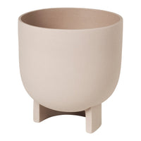Round beige ceramic planter with a smooth matte finish and sturdy footed base. Ideal for modern decor.
