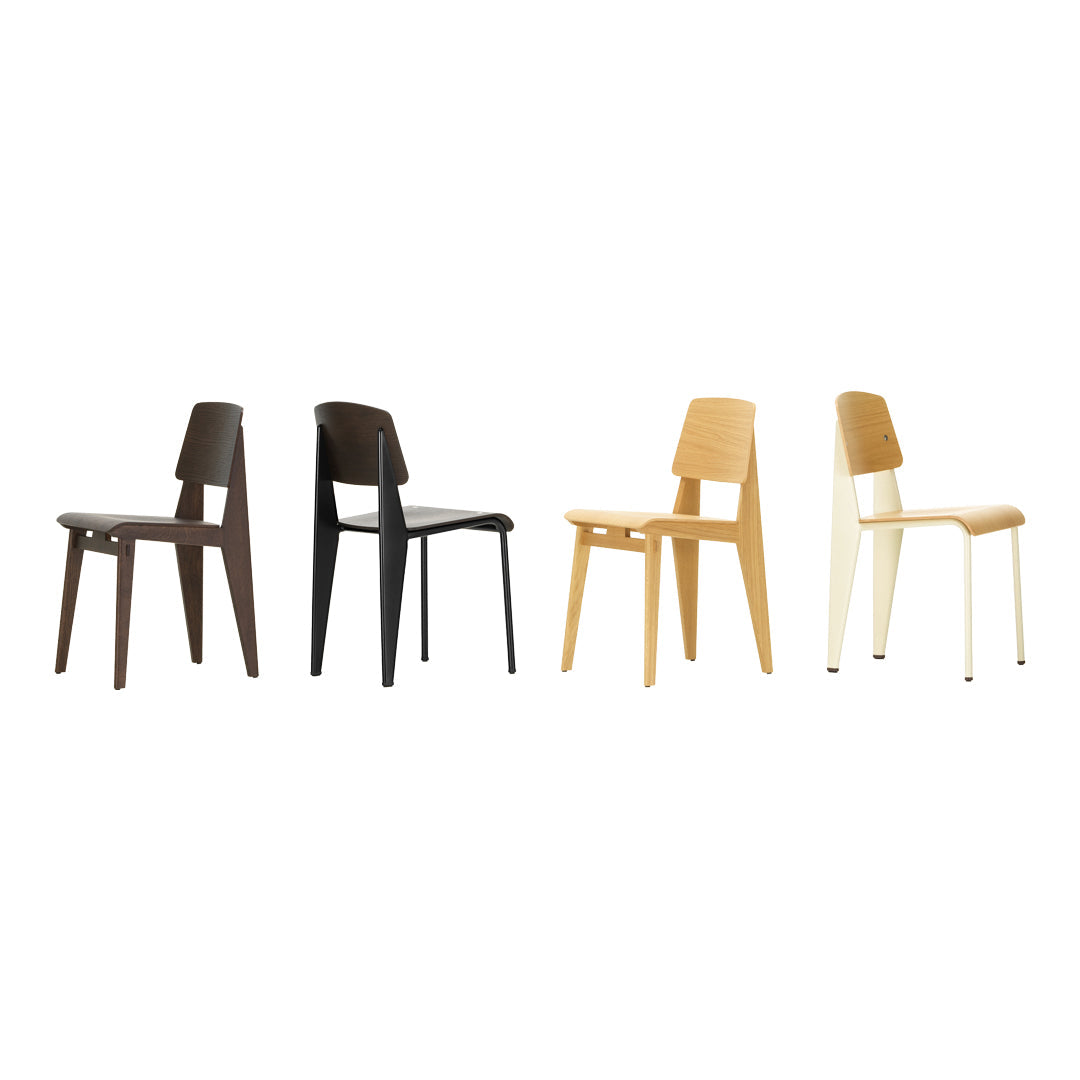 Set of four modern chairs in dark brown, light brown, beige, and cream, featuring smooth, minimalist designs.