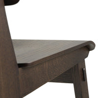 Dark wood chair with a smooth, sloped seat and subtle wood grain patterns.