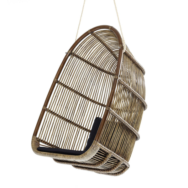 Hanging rattan chair in natural tones with a curved design and black cushion accents. Perfect for stylish decor.