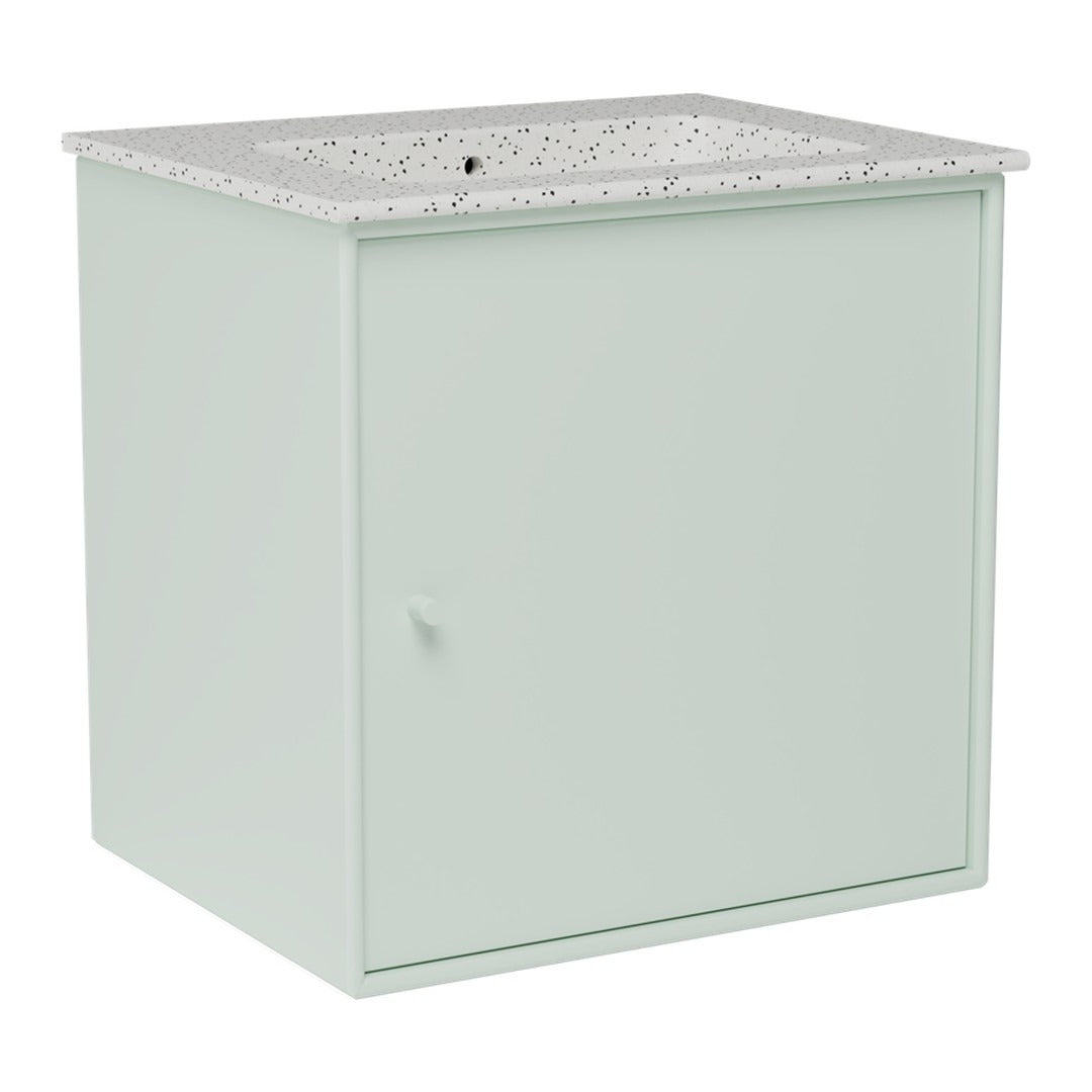 Light mint green cabinet with a speckled white and gray countertop, modern and minimalist design.