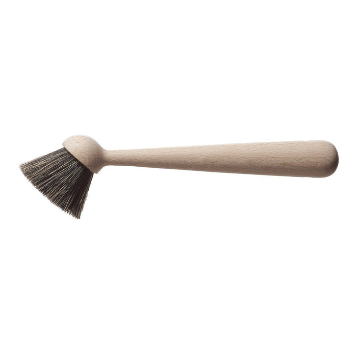 Wooden brush with a natural wooden handle and dark bristles, showcasing a simple, minimalist design.