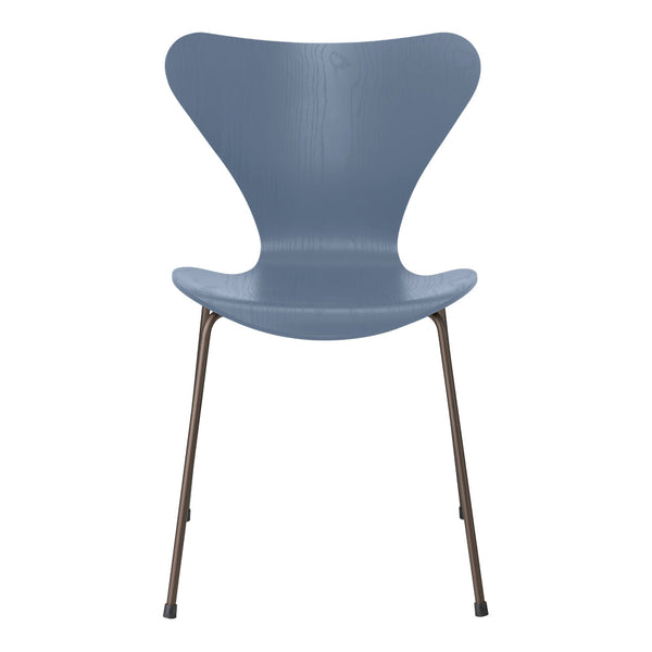 Gray modern chair with a unique butterfly shape and sleek metal legs, perfect for contemporary decor.