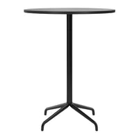 Round black tabletop with a sleek black metal base, featuring a minimalist design. Perfect for modern settings.
