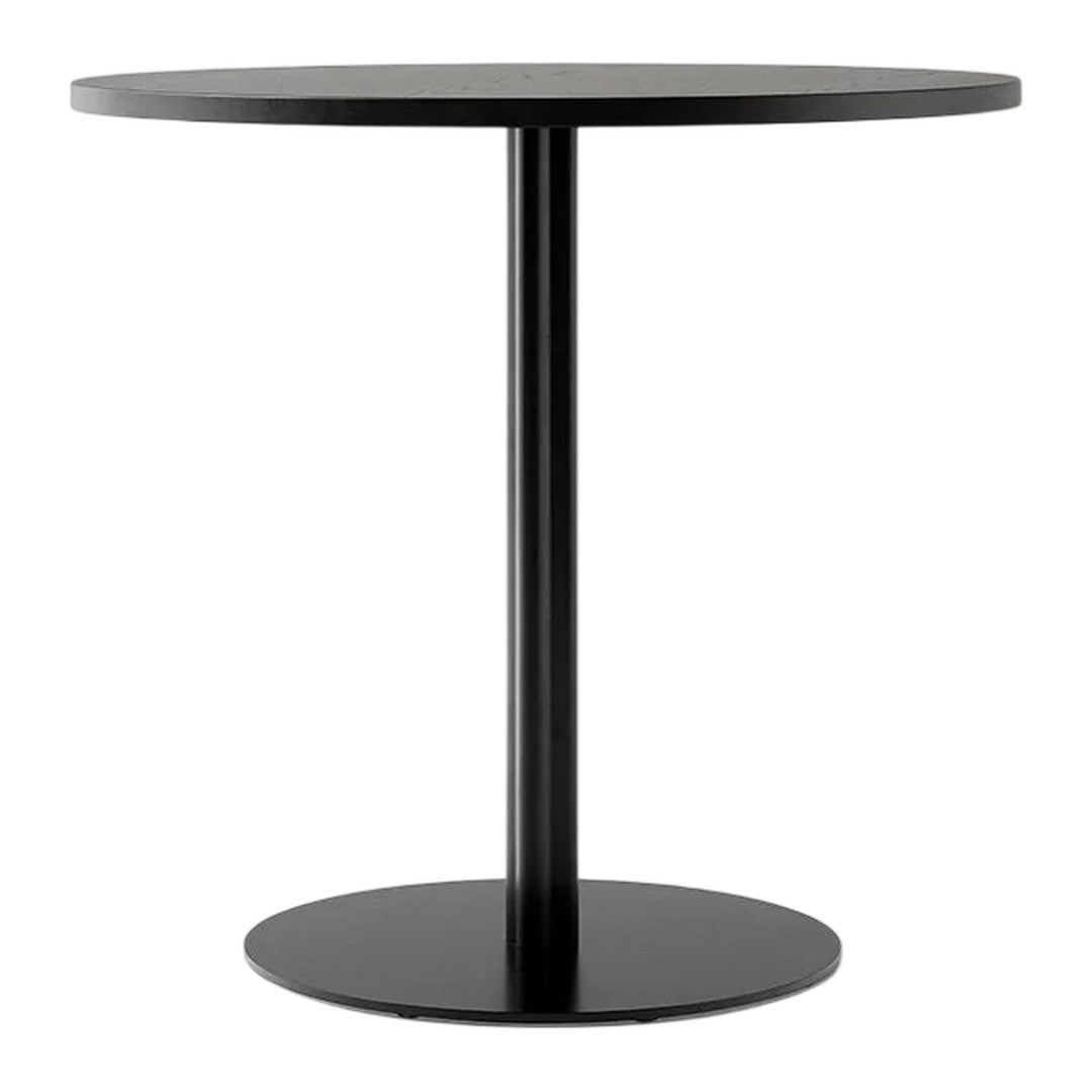 Round black table with a sleek, minimalist design featuring a smooth top and sturdy circular base.