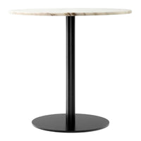 Round marble top table with a black metal base, featuring a smooth, natural stone pattern and minimalist design.