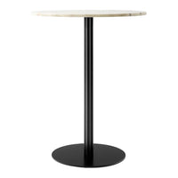 Round marble-top table with a creamy white surface and sleek black metal base. Modern and minimalistic design.