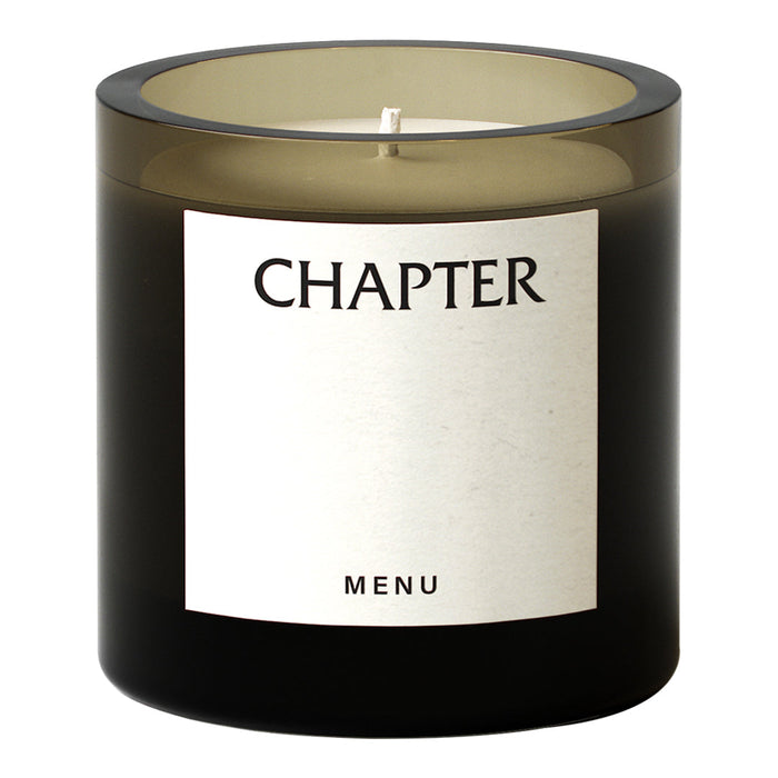 Black glass candle holder with an elegant beige label, subtle color gradient, and minimalist design.