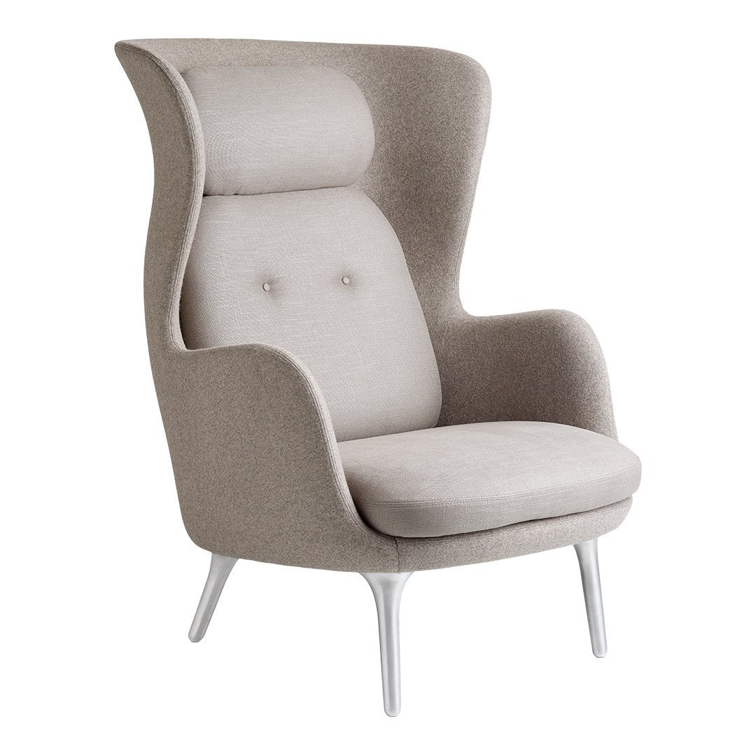 Light beige upholstery with a smooth texture and subtle button tufting; modern design with sleek white legs.