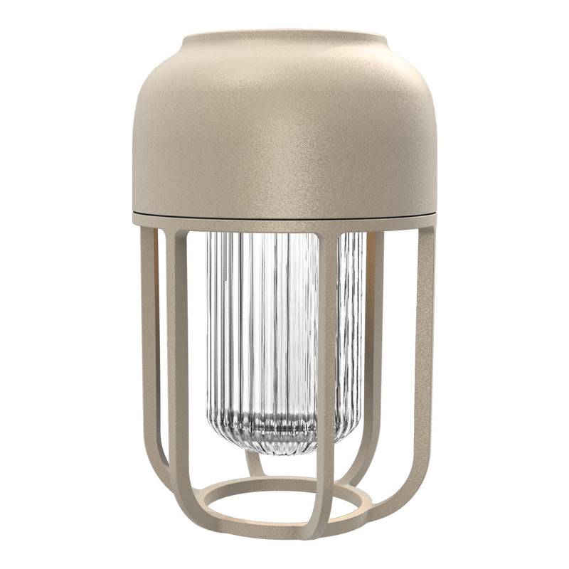 Beige lamp with a clear glass shade, featuring a minimalist design and an open metal cage pattern.