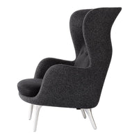 Sleek black armchair with a textured dark gray upholstery and elegant silver legs. Modern and stylish design.