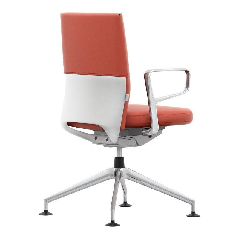 Orange upholstered chair with a sleek white backrest and chrome base, offering a modern and stylish design.